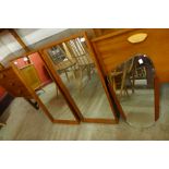 Three teak framed mirrors