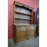 A Victorian style pine dresser, 198cms h, 135cms w, 59cms d