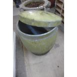 A galvanised dust bin and lid