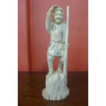 A 19th Century oriental carved ivory figure, 20cms h