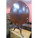 A George III mahogany circular tilt-top tea table, 71cms h x 88cms d