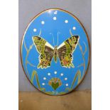 A large oval painted butterfly plaque or table top, 139 x 108cms