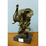 A French style bronze elephant bust, on black marble socle, 28cms h