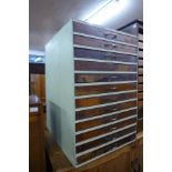 A painted pine and beech twelve drawer collectors cabinet