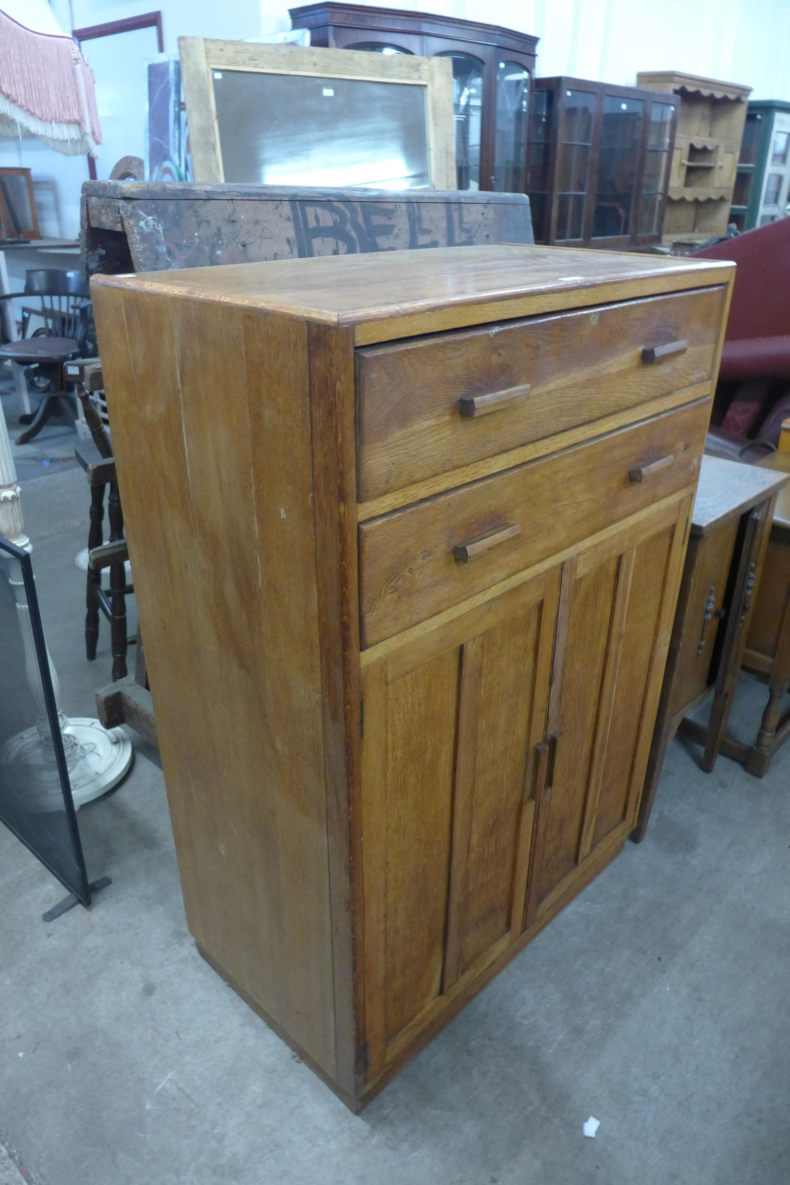 An oak tallboy