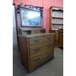 An Arts and Crafts oak dressing chest, 162cms h, 91cms w, 52cms d