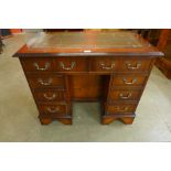 A George II style yew wood and green leather topped kneehole desk, 75cms h, 94cms w, 49cms d