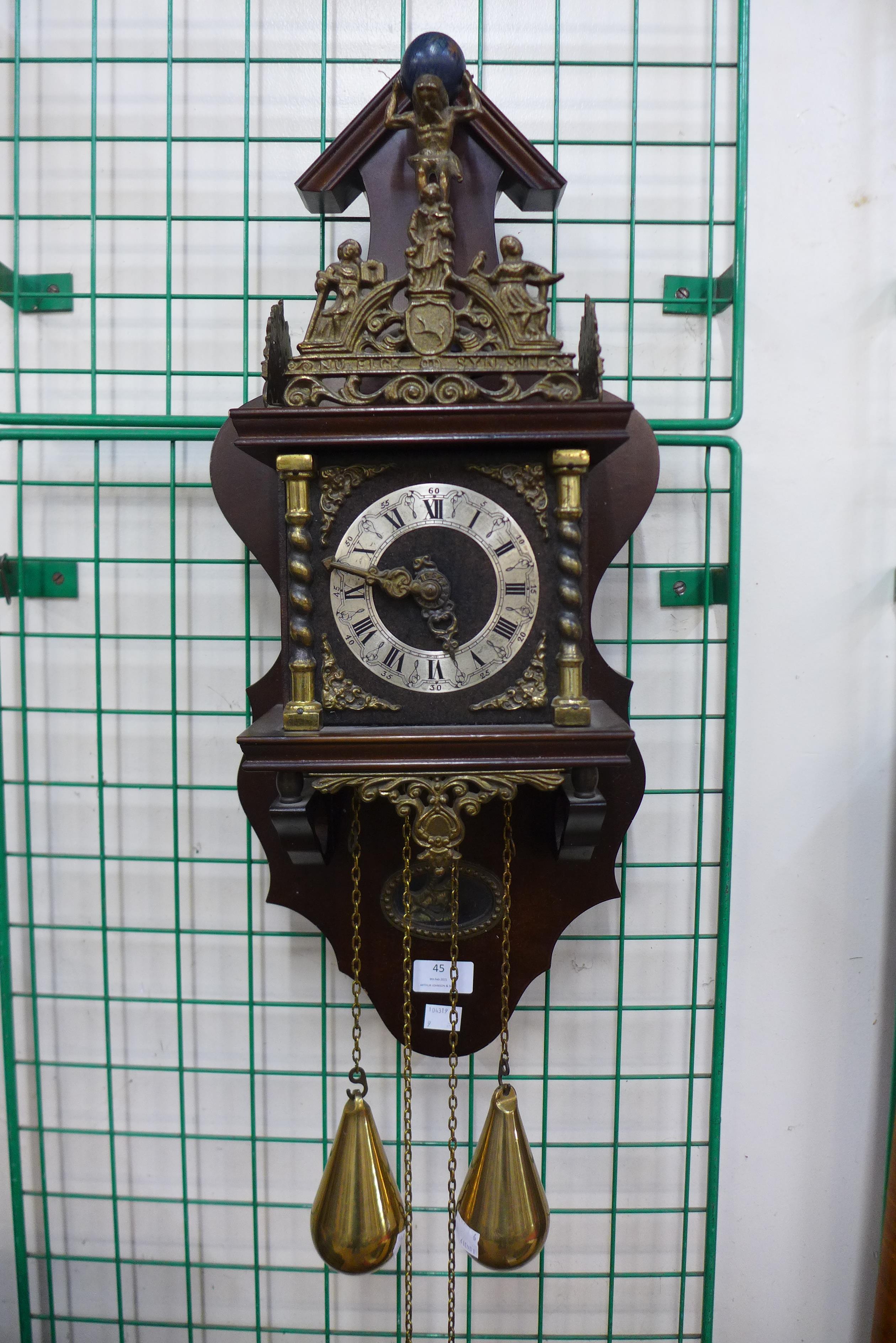 A Dutch mahogany and brass wall clock, 64cms h