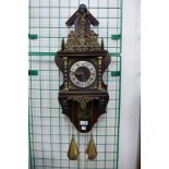 A Dutch mahogany and brass wall clock, 64cms h