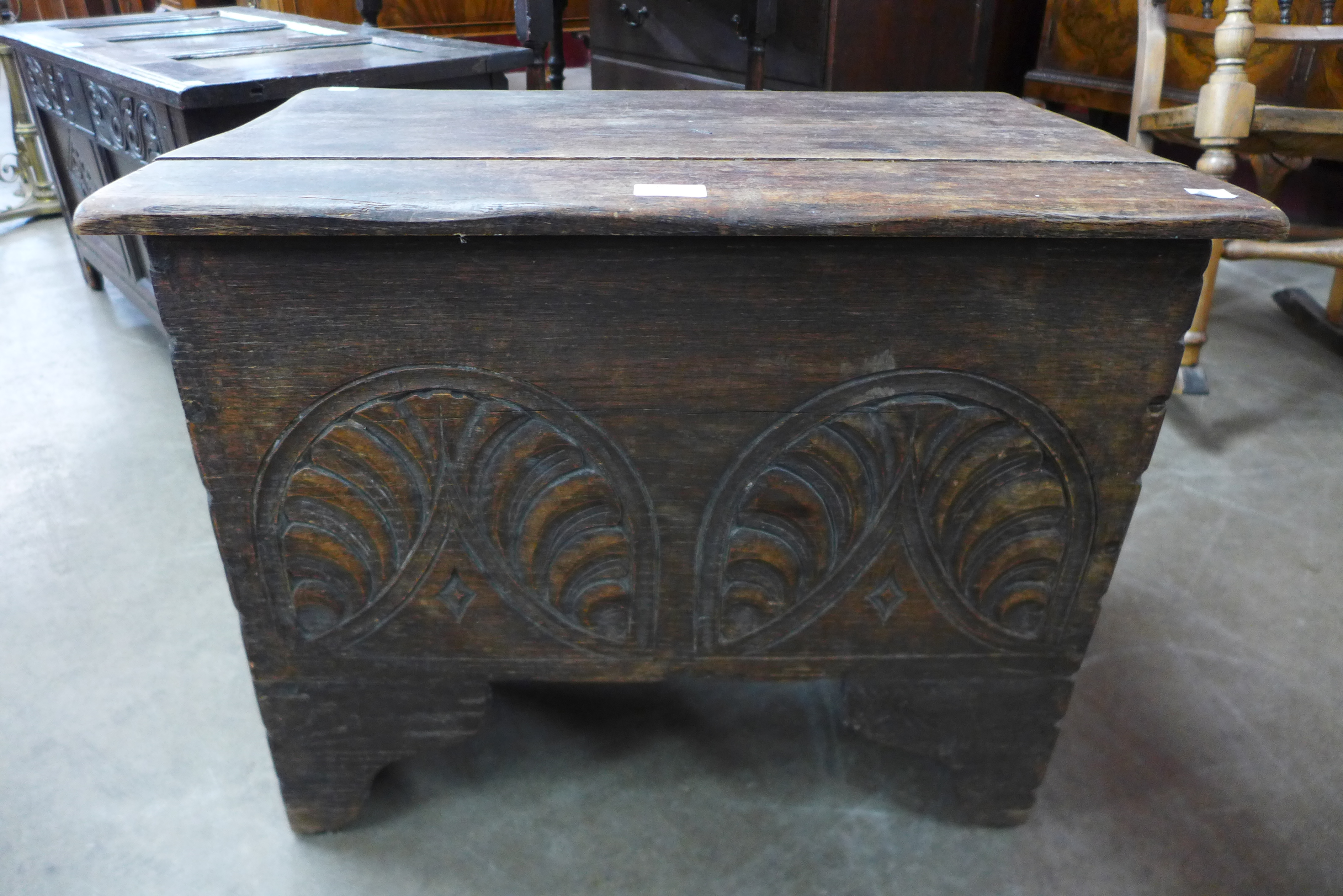 A Charles II carved oak coffer, 53cms h, 64cms w, 41cms d