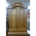 A pine wall mounted kitchen cabinet