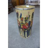 A 1960's fibre glass waste paper bin, decorated with regimental figures, 51cms h