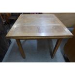 An oak draw-leaf table