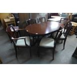 A mahogany extending dining table and six chairs and a mahogany display cabinet