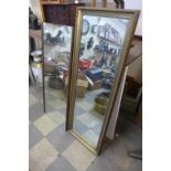 A gilt framed mirror and a teak framed mirror