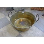 A large Victorian brass jam pan