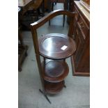 An Edward VII inlaid mahogany folding cake stand