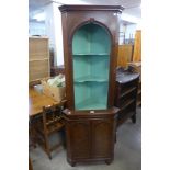 A mahogany and burr walnut freestanding corner cabinet