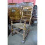 An 18th Century elm and beech rocking chair, 105cms h
