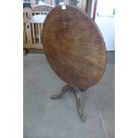 A George III mahogany circular tilt top tea table, 74cms h x 82cms d