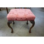 A George IV style carved mahogany and upholstered stool, 54cms h x 56cms w