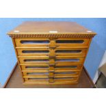 A Tudor beech counter top cotton reel haberdashery shop cabinet, 41cms h, 45cms w, 35cms d