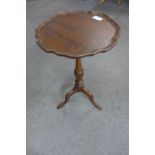 A mahogany tripod wine table