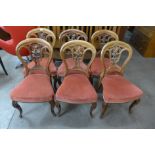A set of six Victorian mahogany balloon back dining chairs
