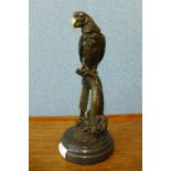 A bronze figure of a parrot, on black marble socle, 32cms h
