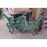 Two pairs of cast iron garden bench ends