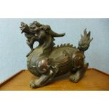 A large Chinese bronze foo dog, 37cms h