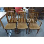 A set of six teak dining chairs