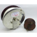 An Australian Bakelite and steel fishing reel, marked Alvey Snapper reel and a smaller wooden