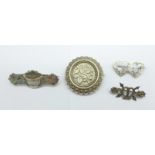 A Victorian silver brooch with gold applied decoration, Birmingham 1894, an Edwardian silver brooch,