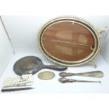 A silver backed hand mirror, an oval silver backed handbag mirror, a silver pencil, a silver handled