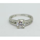 A 9ct white gold and cubic zirconia solitaire ring, with stone set shoulders, 1.8g, M, (1.1ct main