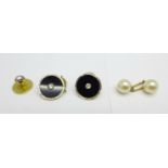 Two 18ct gold and platinum buttons, a 15ct gold and diamond stud and a single yellow metal and pearl