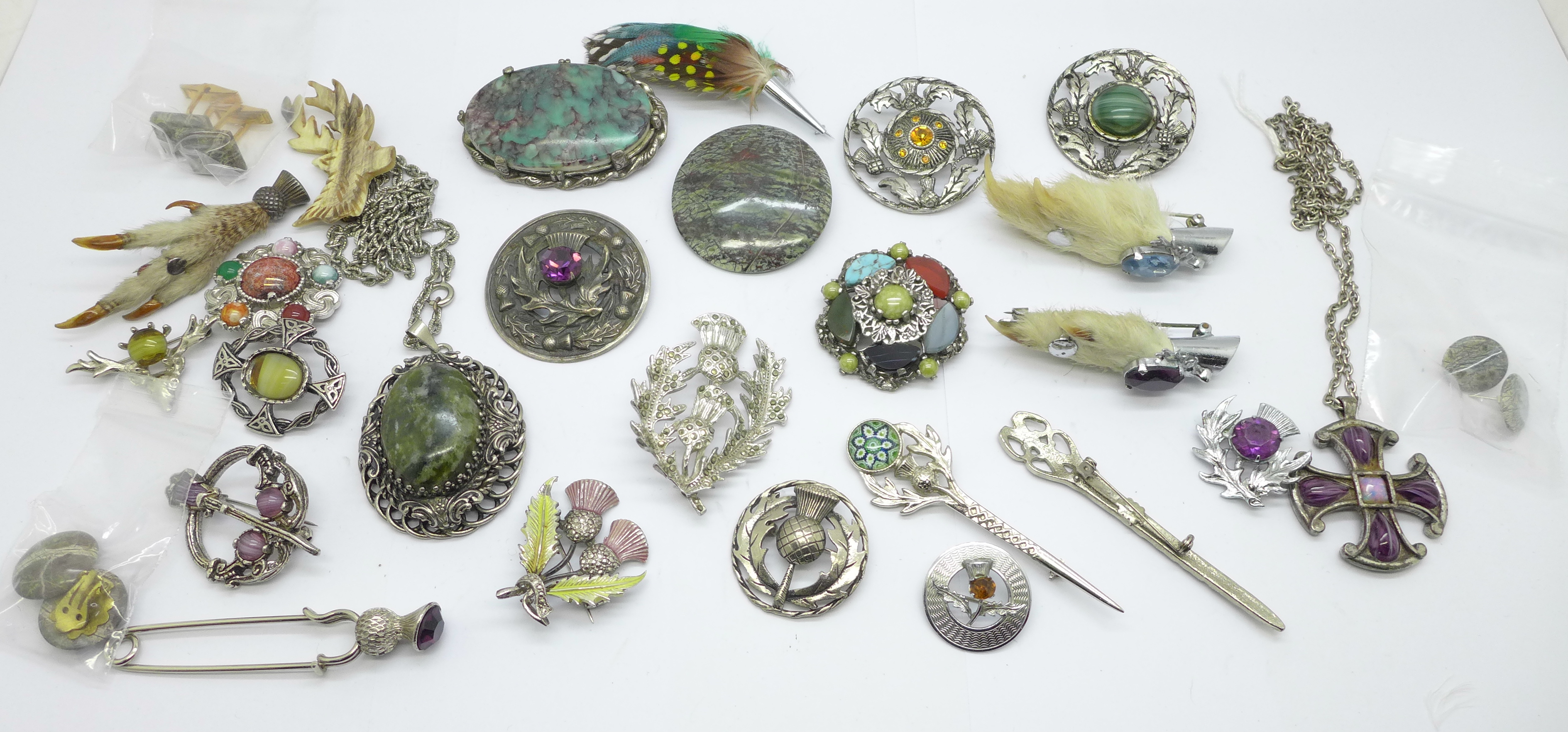 A collection of Celtic style and Scottish brooches