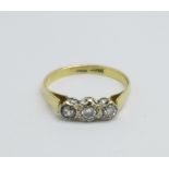 An 18ct gold, three stone diamond trilogy ring, 2.4g, M/N