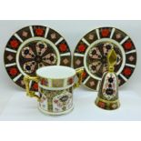 A Royal Crown Derby 1128 pattern loving cup, two tea plates (one a/f, second) and a candle snuff