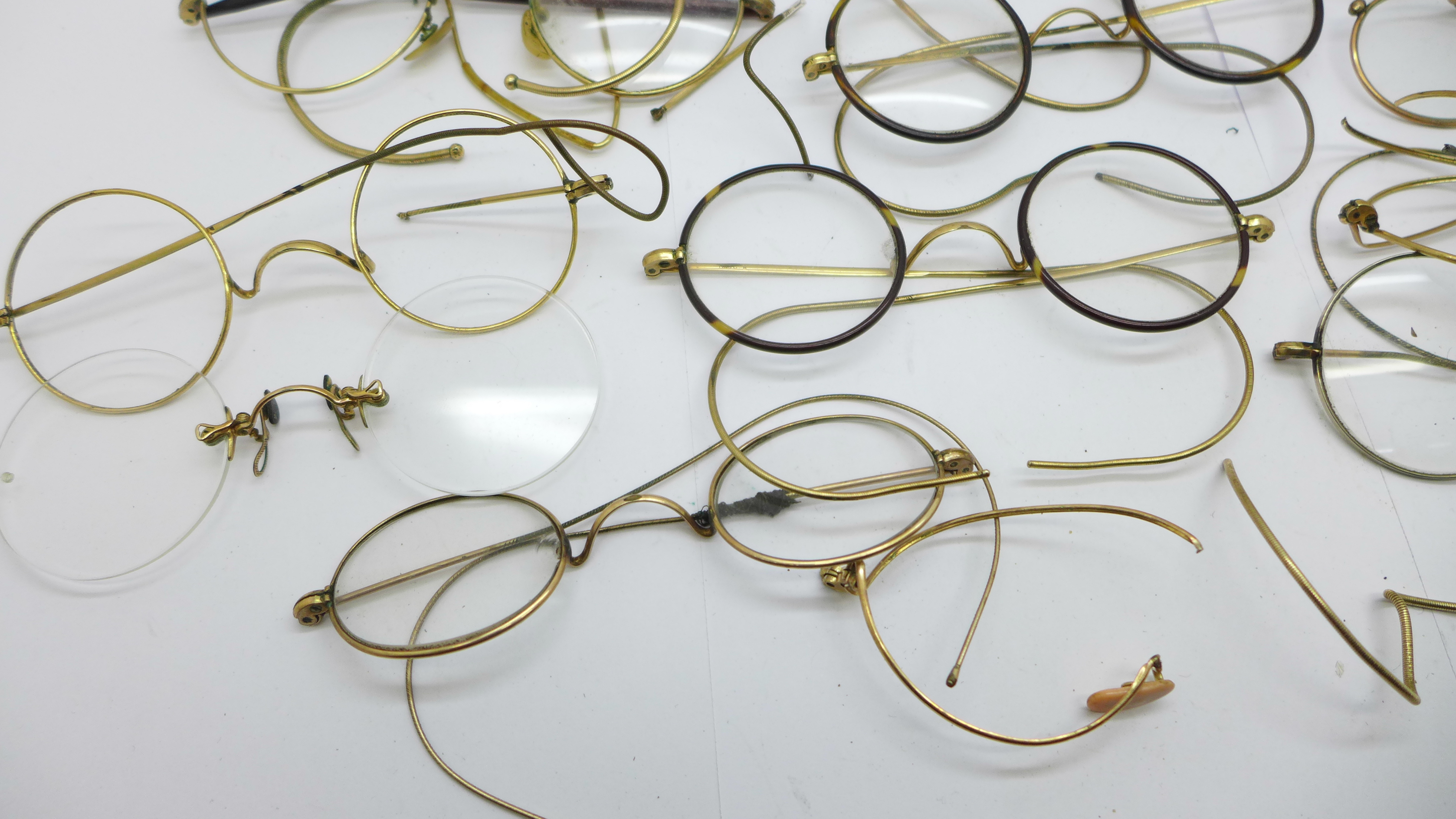 A collection of spectacles, one pair with nose rim marked 9ct, mostly plated, some a/f - Image 2 of 3