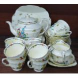 A Crown Staffordshire floral pattern teaset, two cups a/f