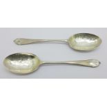A pair of Arts and Crafts style silver spoons with hammered bowls, London 1915, Sandheim Brothers,