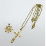 A 9ct gold cross pendant and chain and a hallmarked 9ct gold ships wheel charm, total weight 4.2g