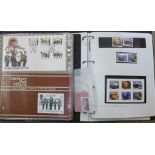 Stamps; approximately forty Guernsey First Day Covers and eighteen mint stamps in one folder, and