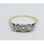 A yellow and white metal set three stone diamond trilogy ring, approximately 0.75ct diamond