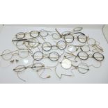 A collection of spectacles, one pair with nose rim marked 9ct, mostly plated, some a/f