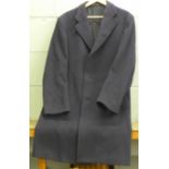 A navy blue Crombie overcoat, retailed by Rackhams, (one loose button, no size labels but estimate