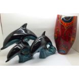 Three Poole pottery models of dolphins, one a/f and an Anita Harris Art Pottery vase, 23cm