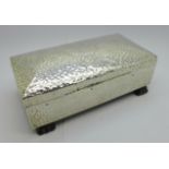 A hammered silver cigarette box, hallmark worn, possibly Birmingham 1904, width 172mm, with monogram